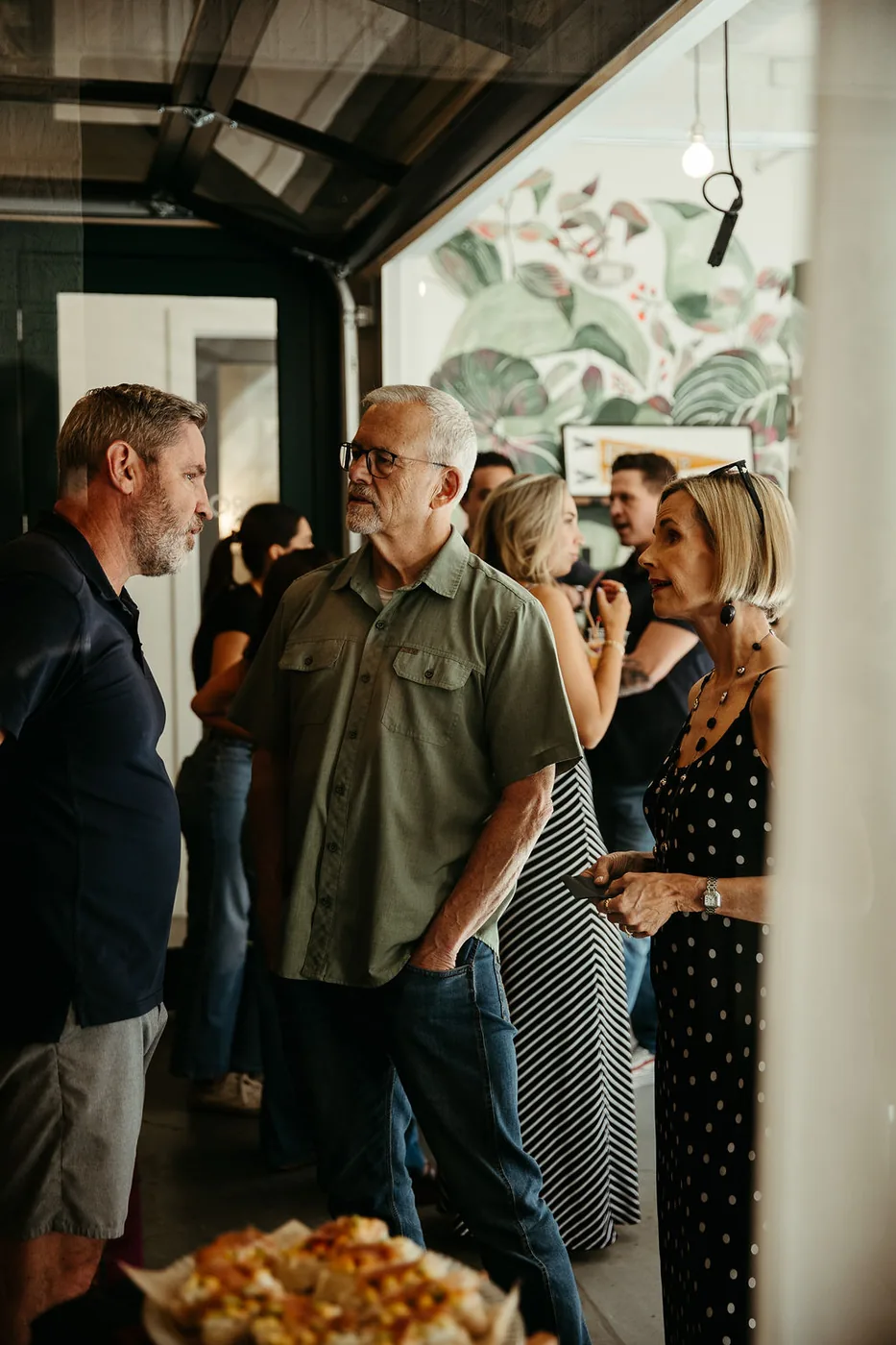 Guests connecting over conversation at a THRIVE event