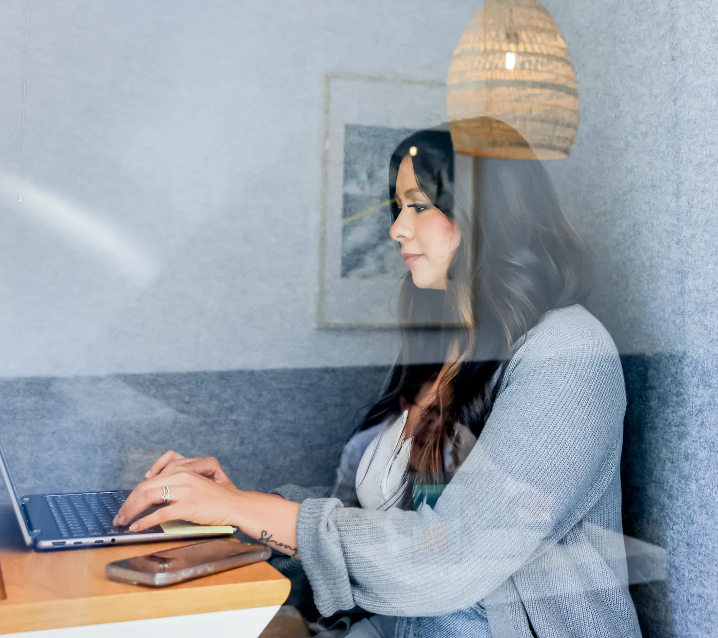 A member on a call in a private phone booth at THRIVE